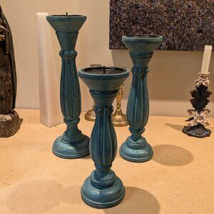 A Set of Turquoise Blue Wooden Candle Holders